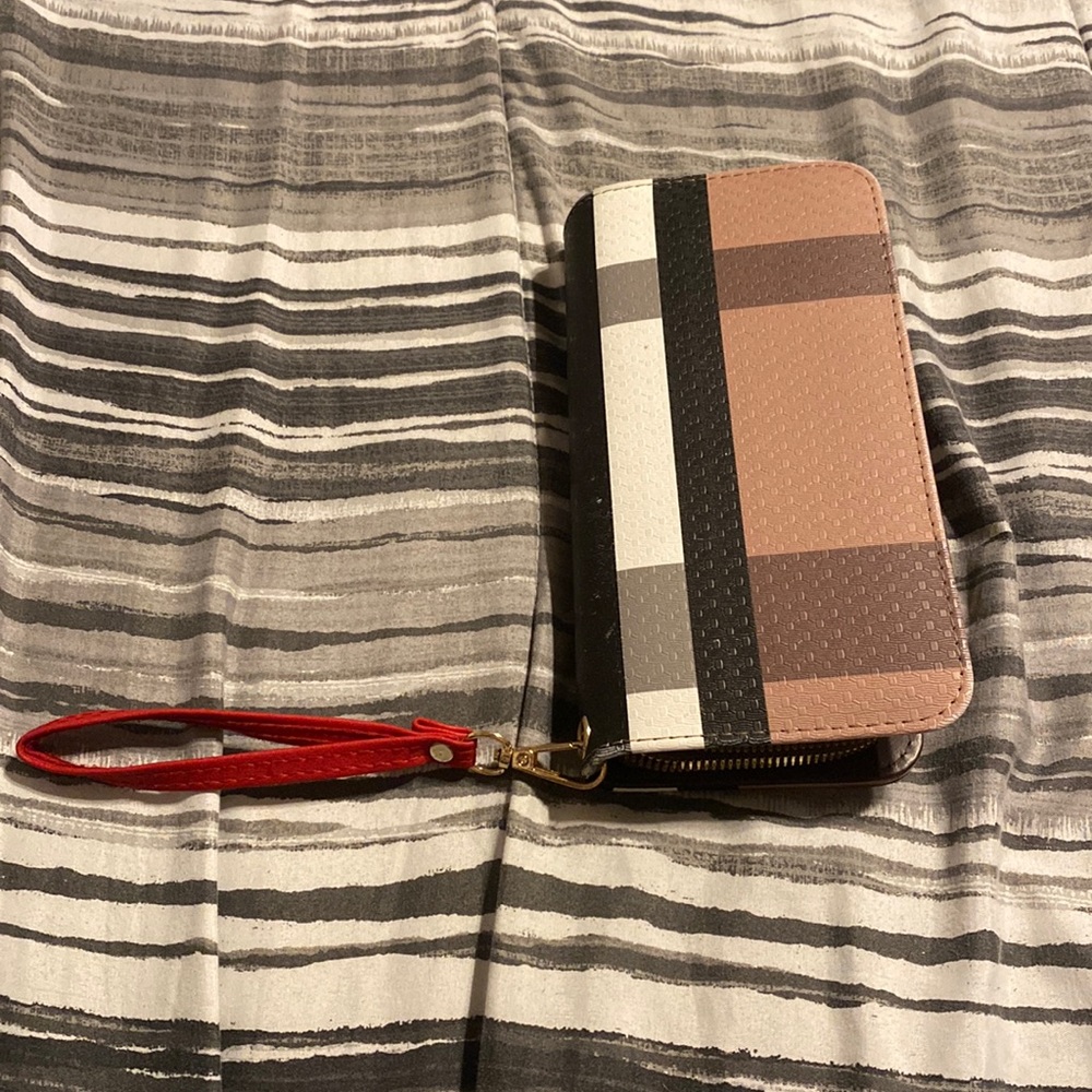 Wristlet strap is included